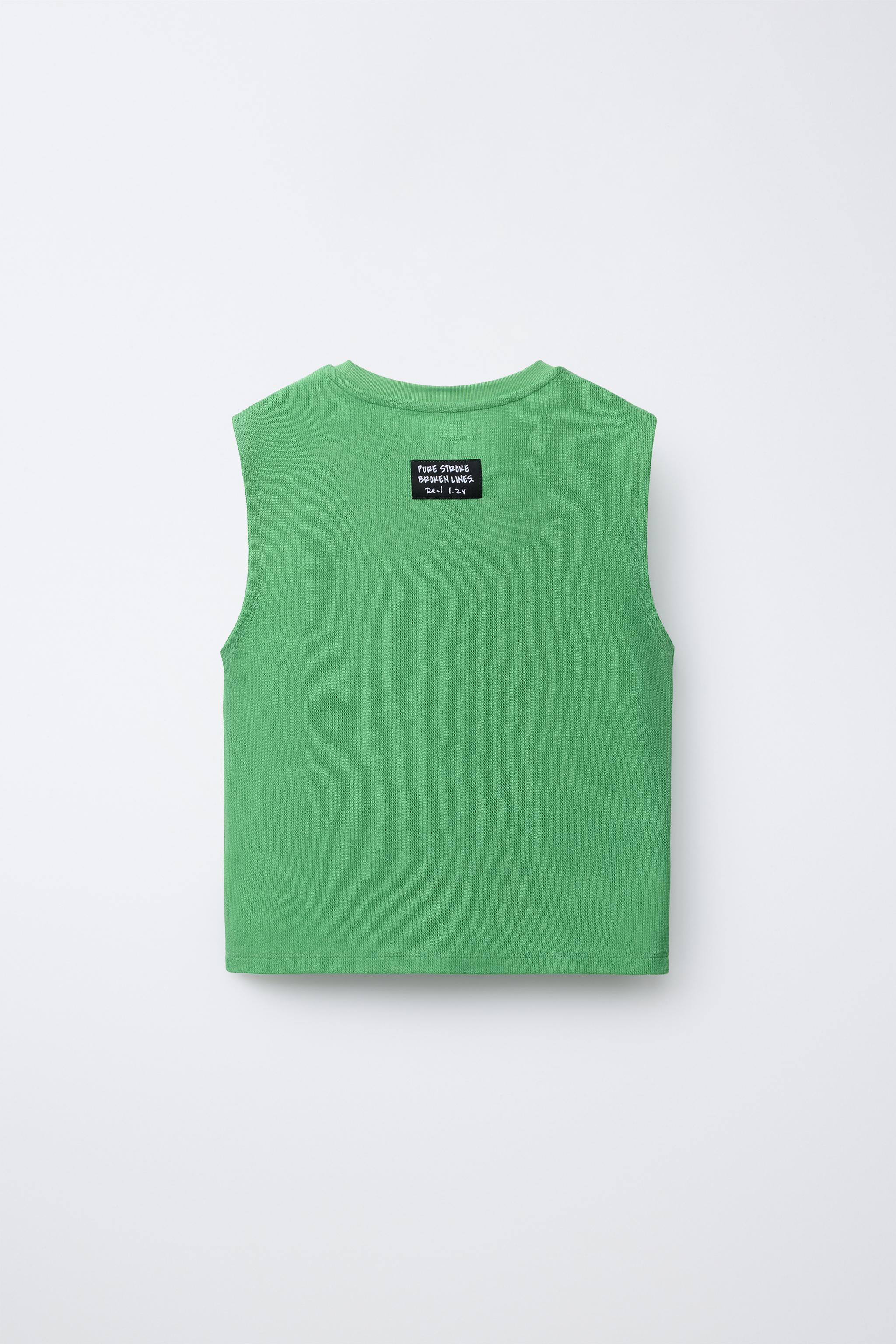 T-SHIRT SANS MANCHES AVEC INSCRIPTION EN RELIEF